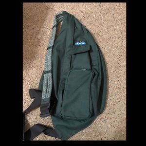 Hunter green Kavu rope-sling bag.